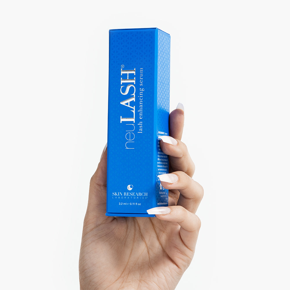 neuLASH® blue packaging box held up by a model&#39;s hand