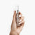 {"alt":"neuCONTOUR™ brow enhancing serum light medium product held up by model's hand","variant-title":"light-medium"}